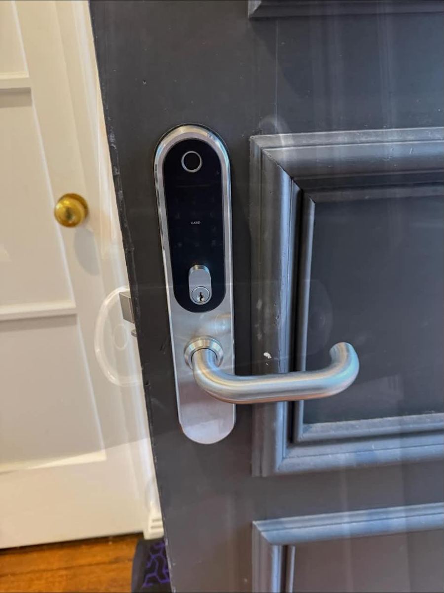 Fingerprint smart lock fitted to a panelled front door